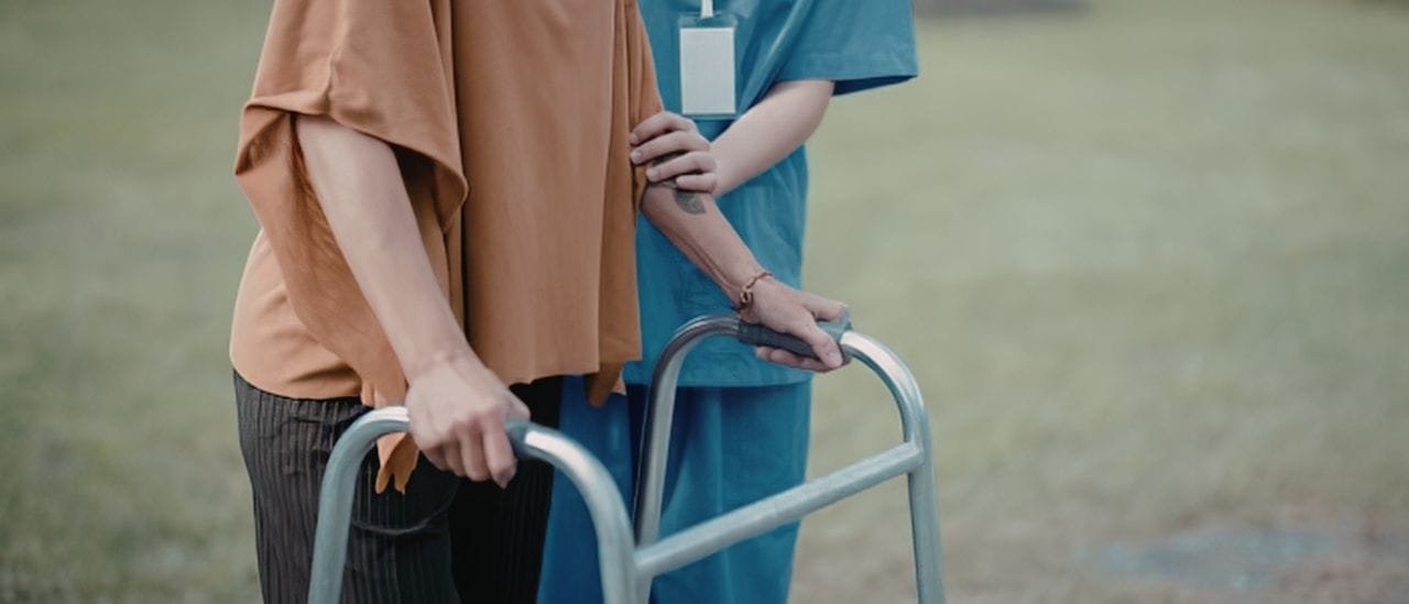 Care worker spending quality time with an elderly person, providing companionship and emotional support.